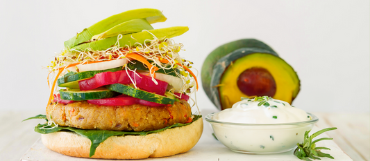 Balviten Hamburger rolls with chickpea burger, raw vegetables, avocado and yogurt and herb sauce